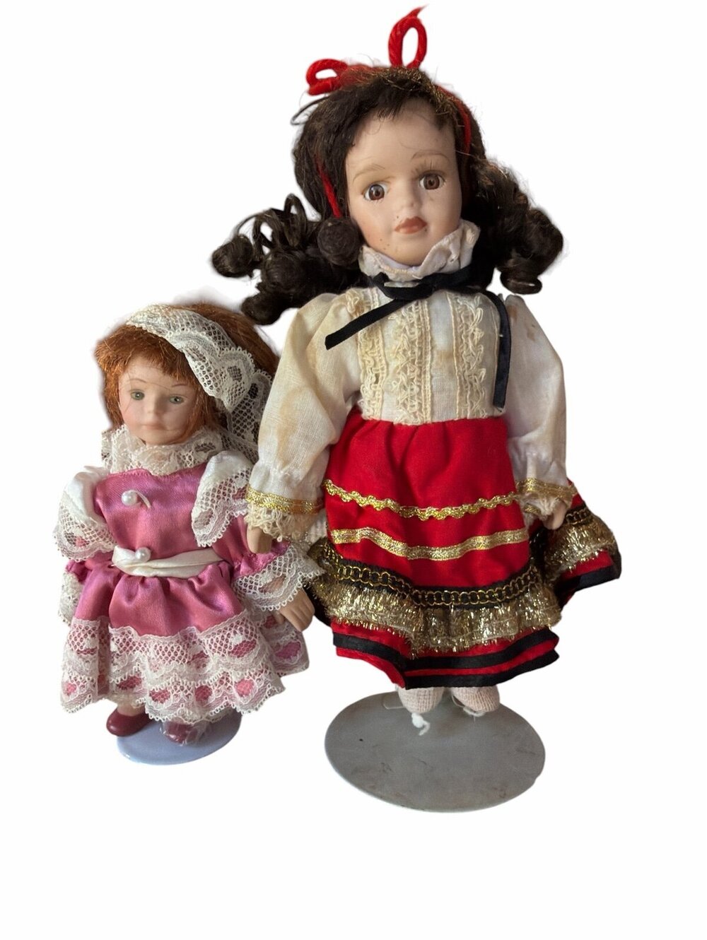 2 little porcelain dolls